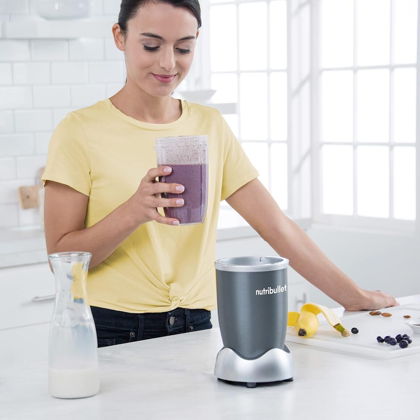 person with Nutribullet Personal Blender